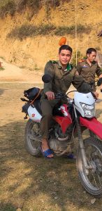 a Laos Border Guard trying out one of our Honda XR150s