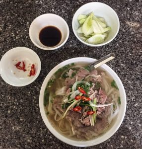 a bowl of pho bo, Vietnamese beef noodle soup