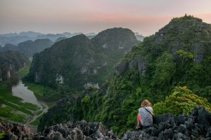taking photographs from atop a mountain in North Vietnam
