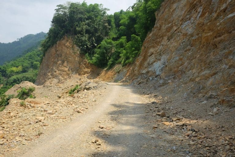 dirt road cut from the hill Hoa Binh