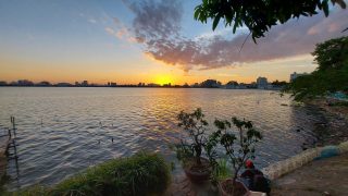 sunset view over west lake hanoi from yen phu village