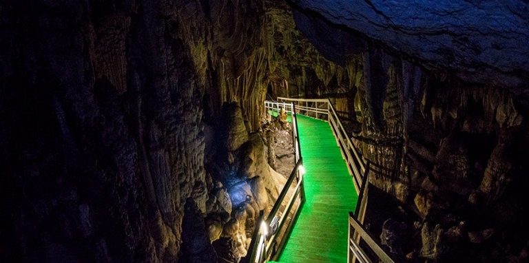 heading down the walkway in Lung Khuy Cave
