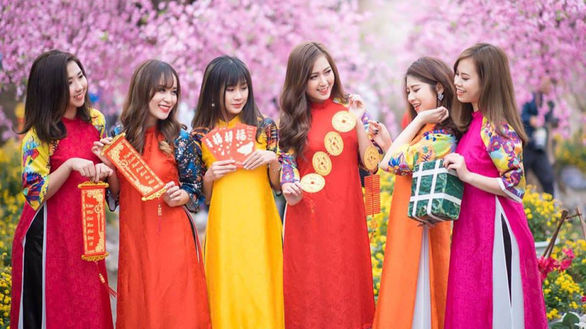 vietnamese girls wearing traditional ao dais for tet in vietnam