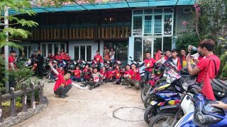 a group of local motorbike tourers at a homestay in Nghia Lo