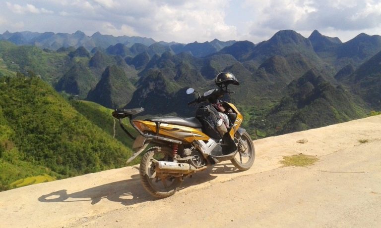 automatic scooter parked on a mountain pass in Ha Giang