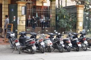 motorbikes parked outside the front of Click Cafe in Tay Ho, Hanoi