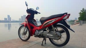 Vietnam Motorcycle Rentals: Honda Blade - back left angle