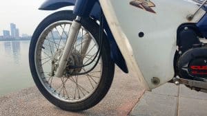 Vietnam Motorcycle Rentals: Honda Cub - front wheel