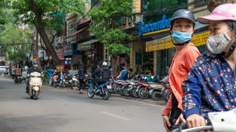 two women on a motorbike in Hanoi's Old Quarter