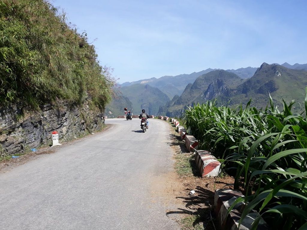 riding through the mountains near Dong Van, North Vietnam on the QL4c road