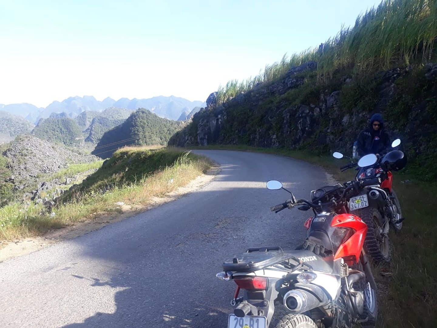 having rest from the XR 150 and a cigarette break on a small road in Dong Van, Ha Giang