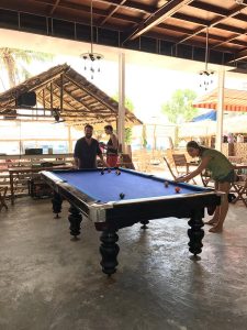 playing pool at the Nhon Hai Beach Hostel