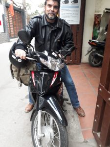 A customer taking one of our Honda Blade semi automatic bikes from rentabike hanoi