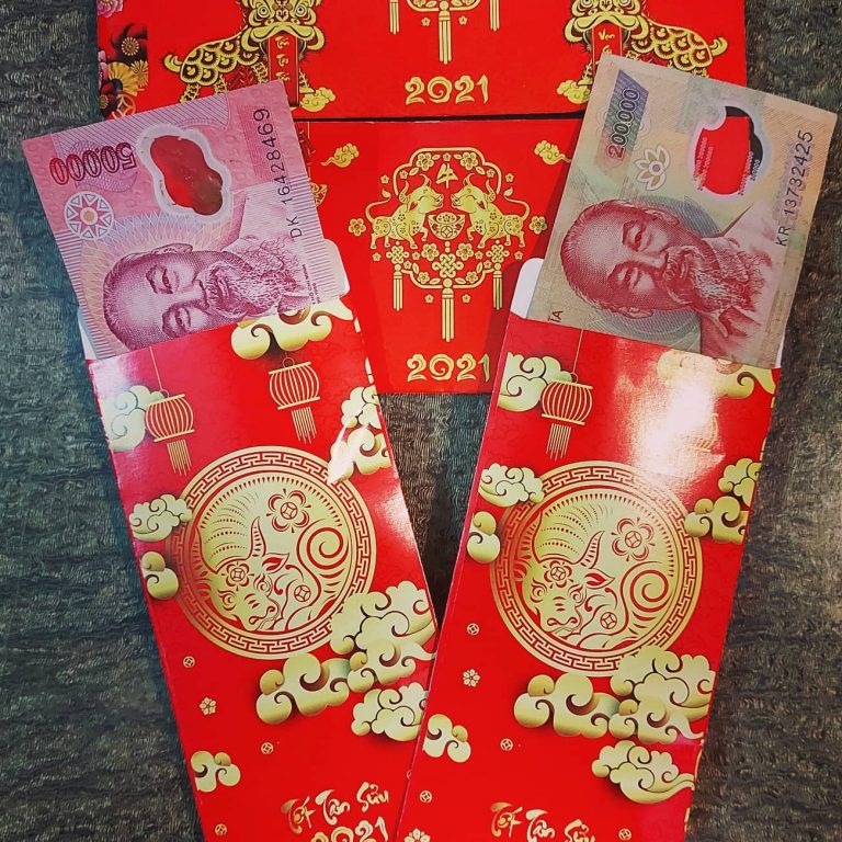 Red envelopes with money to give to children for Tet