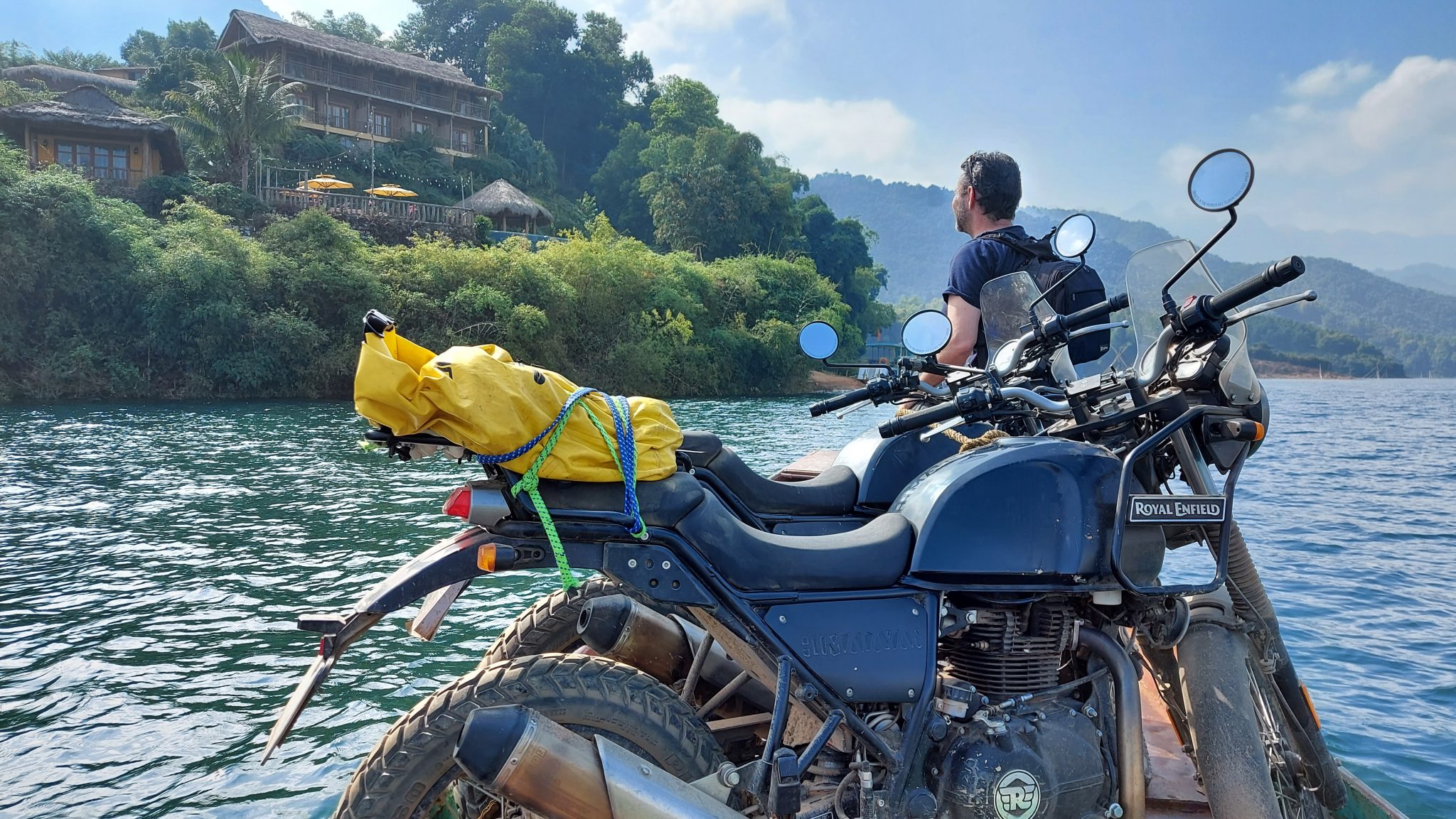 Digby from Explore Indochina taking his Himalayan across the water