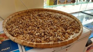 walnuts in a basket drying in meo vac ha giang