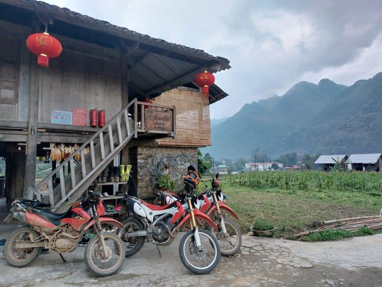 Honda CRF motorcycles at a small family homestay in Du Gia, Ha Giang