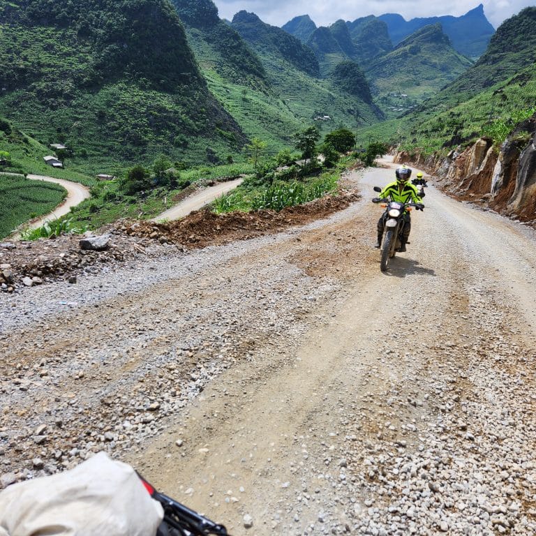 driving up the tricky gravel terrain created by all the road building in Ha Giang province