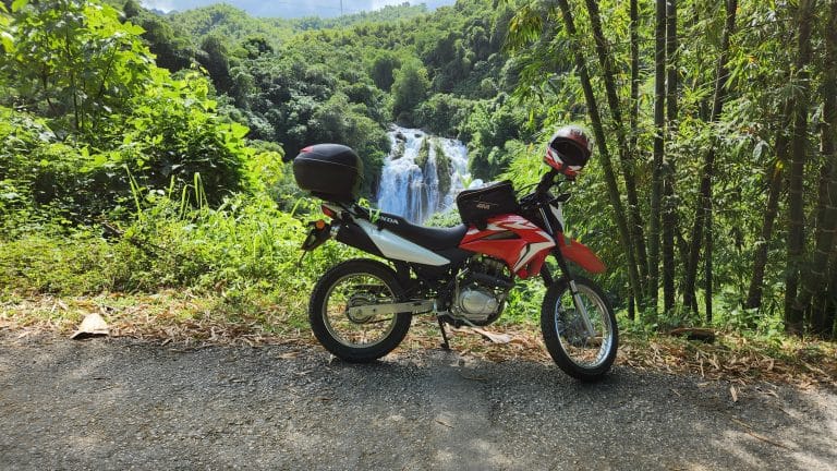 Honda XR150 in front of Go Lao Waterfall, Hoa Binh