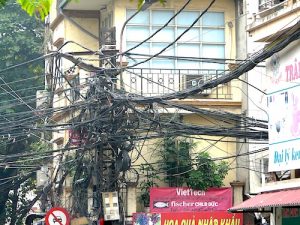 a maze of electricity cables in street in vietnam