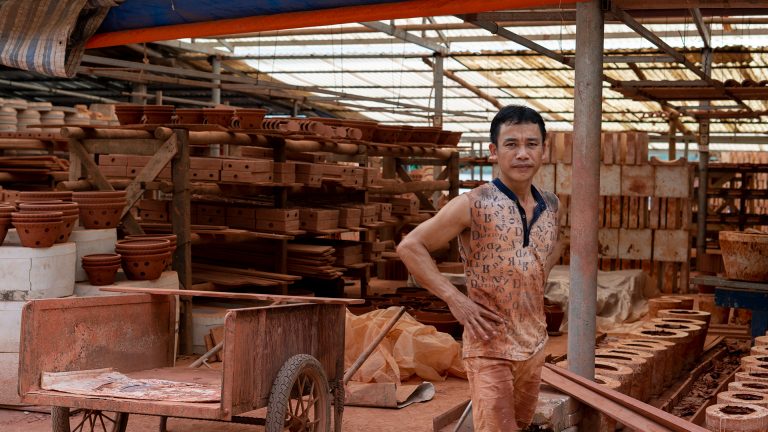 a craftsman in Bat Trang Pottery Village