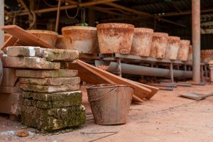 pots and a bucket in Bat Trang Pottery Village