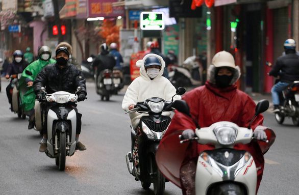driving a motorbike in the cold weather in vietnam