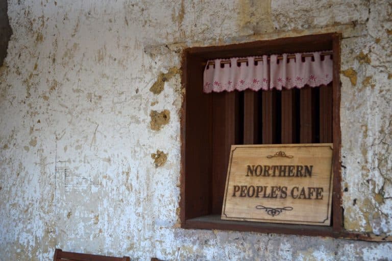 the shop sign for the northern people's cafe in lung cu, ha giang
