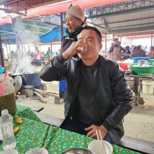 Drinking Rice wine in Sin Cheng Market, Lao Cai