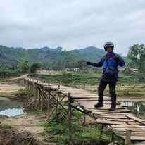 Paul Brooke on the rickety bridge in Hoang Su Phi
