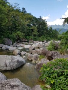a calm boulder laden stream in the middle of nowhere in ha giang