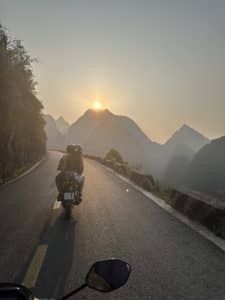 riding into the sunset on the QL4C Happiness road in ha giang