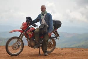 Danny on a hill somewhere in Laos on a Honda XR125