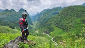 motorcyclist looking out over mini Ma Pi Leng in Ha Giang
