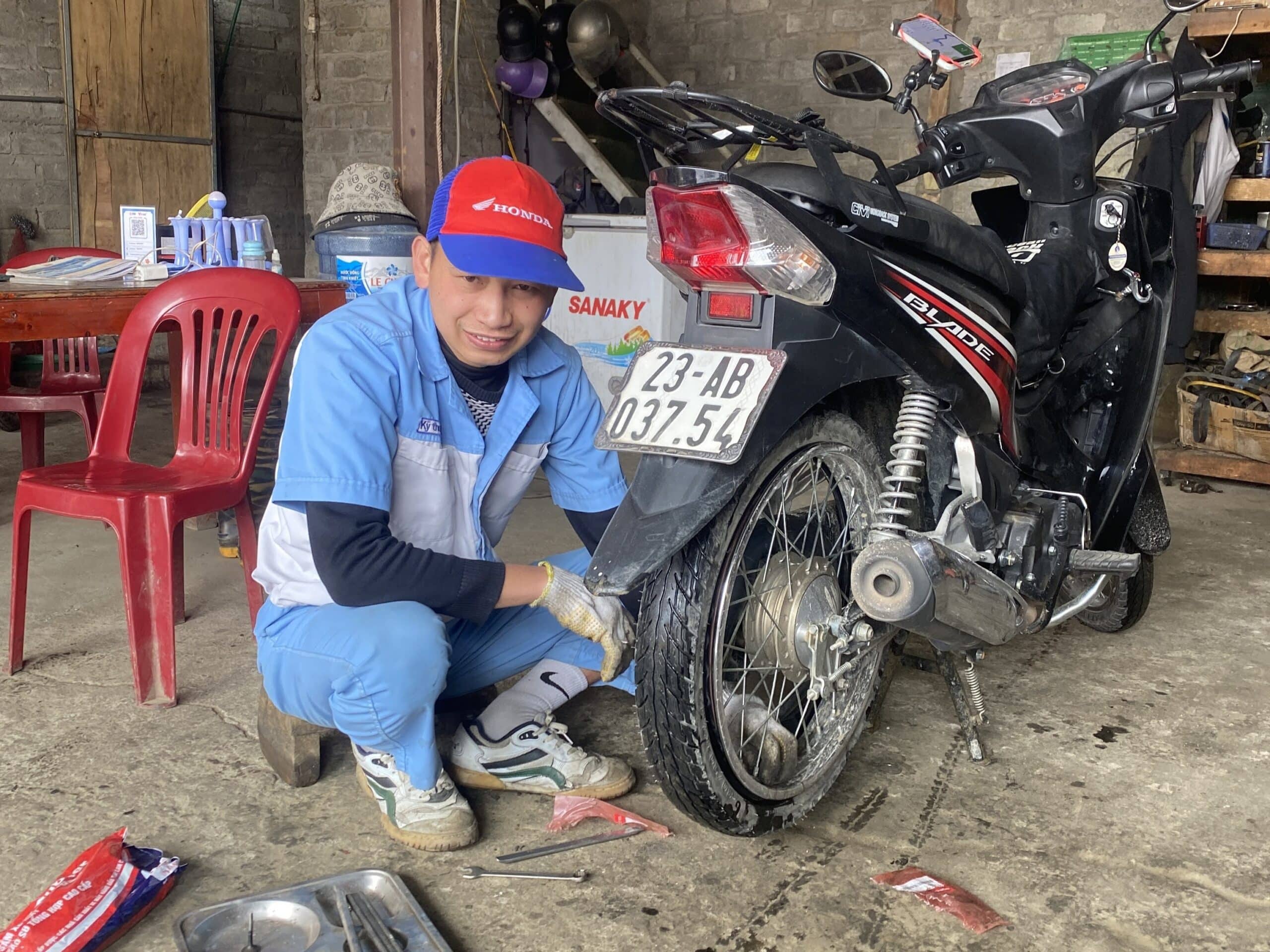 Local independant mechanic fixing our Honda Blade in his living room.