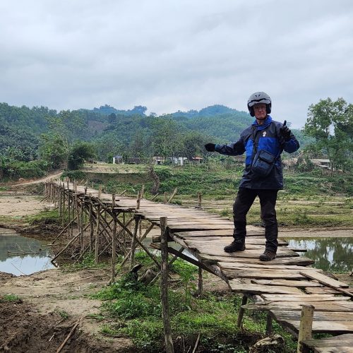 Paul Brooke on the bamboo bridge on the way to Yen Bai Province