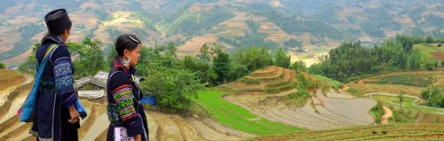 Black Hmong women looking over rice fields by Stupid Dream