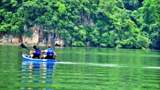 two tourists kayaking on Ba Be Lake