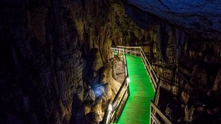 heading down the walkway in Lung Khuy Cave