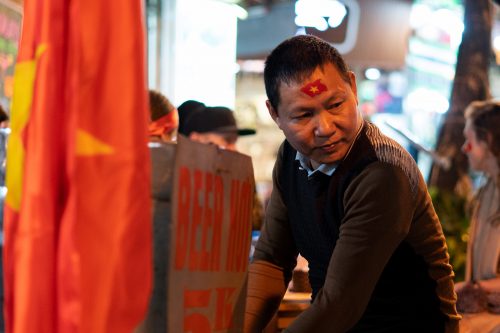 man selling cheap beer in Hanoi's Old Quarter