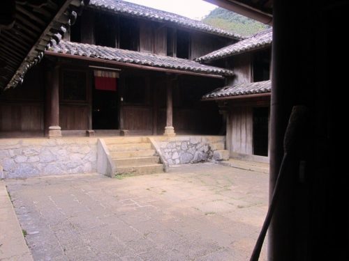 the H’mong King’s Palace - a beautiful structure of stone courtyards, wooden doors, and tiled roofs