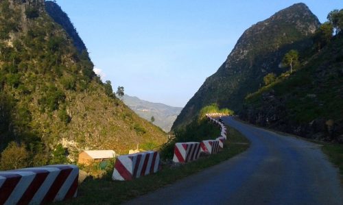 the new roads in Ha Giang wind around the often vertical slopes of the limestone karsts